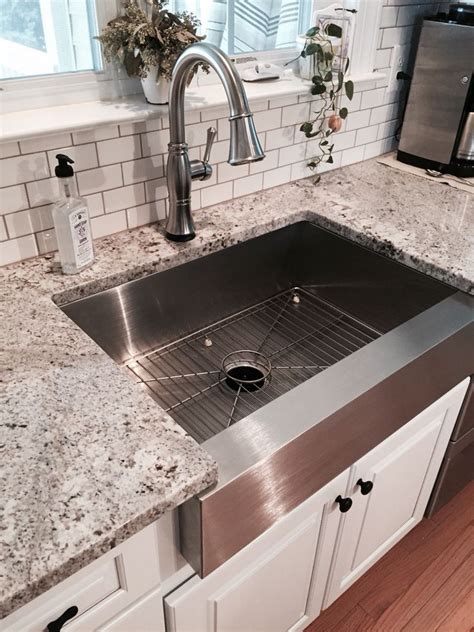 stainless steel farmhouse sink with white cabinets black countertops|farmhouse distressed white kitchen cabinets.